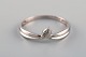 Margit E. 
Collection, 
Denmark. 
Alliance ring 
in 9 carat 
white gold 
adorned with 
cubic 
zirconias. ...