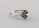 Swedish 
jeweler. Ring 
in 18 carat 
white gold 
adorned with a 
brilliant and 
22 diamonds. 
Late 20th ...