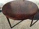 Round dining 
table in 
rosewood veneer 
with two 
extension 
leaves. Danish 
modern from the 
1960s. ...