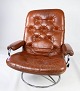 Easy chair 
upholstered 
with brown 
patinated 
leather of 
norwegian 
design from the 
1970s. The ...
