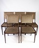 Set of five 
dining room 
chairs in dark 
wood and dark 
fabric of 
danish design 
manufactured by 
...