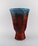Accolay, 
France. Large 
art deco vase 
in glazed 
ceramics. 
Beautiful glaze 
in red and blue 
shades. ...