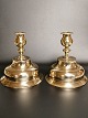 A pair of 
almost 
identical brass 
candlesticks 
from the early 
1700s Height 
15.5cm. 
diameter foot 
...