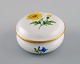 Meissen porcelain lidded jar with hand-painted flowers and gold edge. 20th 
century.
