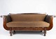 Antique sofa 
upholstered 
with brown 
fabric and 
frame of dark 
wood from 1860. 
The sofa is in 
...