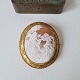 Large beautifully cut cameo set in gold-plated metal. Measures 5.3 x 6.3 cm.