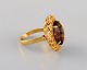 Scandinavian 
jeweler. 
Vintage ring in 
18 carat gold 
adorned with 
smoky mountain 
crystal. ...