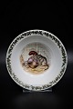 Royal Copenhagen Christmas porridge bowl in porcelain 
with Christmas motif.
RC# 6/14198. 
H:5cm. Dia.:16cm.