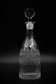 Fine old liquor 
glass carafe 
with fine 
grindings.
H:26cm. Dia: 
8,5 cm.