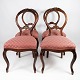 Set of four Rococo dining room chairs of mahogany and upholstered with red fabric from 1860. The ...