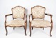Set of two Rococo armchairs of mahogany and upholstered with light fabric, in great antique ...