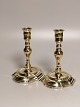 A pair of 
baroque brass 
candlesticks 
18.Arh Profiled 
stem on oval 
base stamped 
Height 16cm. 
Foot ...