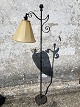 Stand lamp in wrought iron. Newer cord and fully functional, but worn / damaged screen and socket.