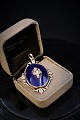 Old pendant in 
silver 
(Stamped) and 
blue glass. 
4,5x3cm.