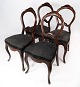 Set of four rococo dining room chairs of mahogany and upholstered with black fabric, in great ...