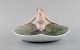 Early and rare Royal Copenhagen art nouveau dish in hand-painted porcelain. 
Naked woman and water lilies. Early 20th century.
