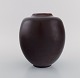 Kresten Bloch for Royal Copenhagen. Unique vase in glazed stoneware. Beautiful 
ox blood glaze. 1920s.
