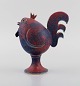 Lars Drejara, Sweden. Rooster in glazed stoneware. Beautiful glaze in shades of 
purple and turquoise. Late 20th century.
