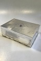 Georg Jensen 
Sterling Silver 
Cigar 
Box/Humidor No 
329 w wodden 
lining Measures 
21.5 cm x 15 cm 
 ...