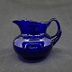 Height 8 cm.Cobalt creamer in glass from Holmegaard Glassworks.It appears for the first ...