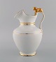Antique 
Gustafsberg 
chocolate jug 
in porcelain 
modeled with a 
lion on the 
handle. 
Hand-painted 
...