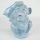 Ceramic figure 
in the shape of 
a monkey with 
light blue 
glaze from the 
1960s. 
16 x 15 x 3 
cm.