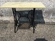 Sewing machine 
table in metal 
with later 
marble top. 
Dimensions: 
HxWxD 74x95x45 
cm