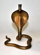Bronze cobra 
with numerous 
decorations, 
20th century. 
Presumably 
Persia. H .: 14 
cm.