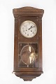 Antique wall clock of oak, from the 1920s.H - 83 cm, W - 35 cm and D - 18 cm.