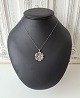 Filigree flower 
with necklace 
in silver
Stamped 925s
Length of 
chain 43 cm.
Diameter of 
...