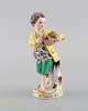 Antique Meissen porcelain figurine. Boy with flower basket. Model 149. Approx. 
1900.
