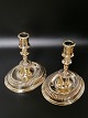 A pair of 19th 
century brass 
candlesticks on 
oval base 
Height 13.2cm 
base 12 x 10cm.