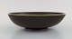 Round Rörstrand 
bowl in glazed 
ceramics. 
Beautiful glaze 
in brown 
shades. 
Mid-20th ...
