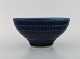 Wilhelm Kåge (1889-1960) for Gustavsberg. Large bowl in glazed stoneware. 
Beautiful glaze in blue / brown shades. Mid-20th century.
