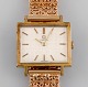 Early 18 carat gold Omega mens wristwatch. Stylish art deco design. 1930s / 40s. 18 carat gold bracelet, Swedish control stamps.