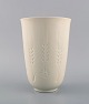 Royal Copenhagen blanc de chine vase with flowers and corn tassels in relief. 
Model number 4162. Dated 1975-79.
