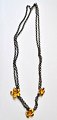 Sterling 
double-breasted 
necklace with 
gilded flowers, 
20th century 
Denmark. 
Stamped: EDJ 
and ...