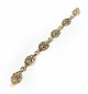 Bracelet 
decorated with 
different 
colours, of 
gilded metal.
20.5 cm.