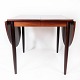 Dining table in 
rosewood with 
extension 
plates, 
designed by 
Arne Vodder 
from the 1960s. 
The ...