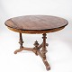 Round dining table of walnut with inlaid wood, in great antique condition from 
the 1890s.
5000m2 showroom.
