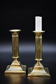 A pair of 
antique brass 
candlesticks, 
Height: 16cm. 
The 
candlesticks 
have an old 
engraving on 
...