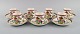 Coalport, England. Seven Flower of Tibet chocolate cups with saucers decorated 
with flowers and gold edge. Mid-20th century.
