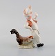 Herend porcelain figure. Boy and rooster. Mid-20th century.
