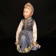 Royal Copenhagen, Carl Martin Hansen; a porcelain figurine of a Amager boy 
#12414