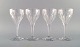 Val St. Lambert, Belgium. Four Legagneux red wine glasses in clear mouth-blown 
crystal glass. Mid-20th century.
