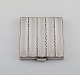 Georg Jensen art deco powder box in sterling silver with interior mirror. Design 
279. Dated 1933-1944.
