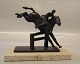 Rider and horse in bronze on marble base  12.5 x 22 cm H: 19 cm  Small chip on the marbel base ...
