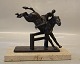 Rider and horse 
in bronze on 
marble base  
12.5 x 22 cm H: 
19 cm  Small 
chip on the 
marbel base ...