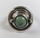 Hans Hansen 
silver ring 
(925) with 
green stone. 
Stone is 
slightly worn. 
Ring size 53.