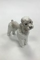 Lladro Figurine 
Poodle 
Measures 14.5 
x 16 cm (5 
45/64 x 6 19/64 
in). Handmade 
in Spain.
